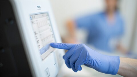 Hand of a clinician using Trilogy EV300