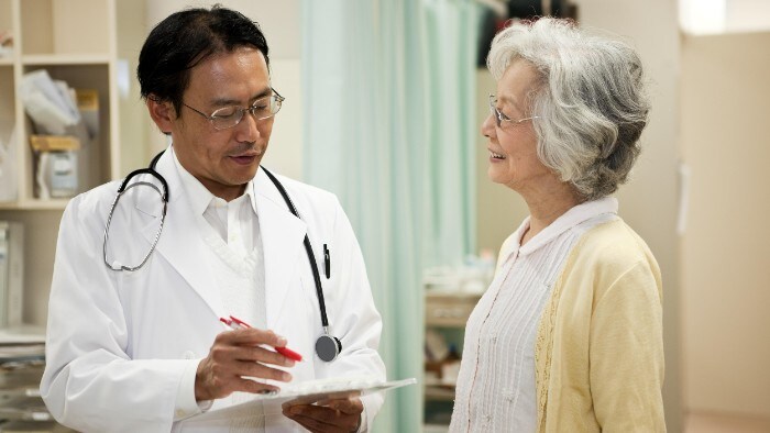 A patient and doctor in discussion in Indonesia